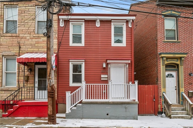 townhome / multi-family property with stone siding