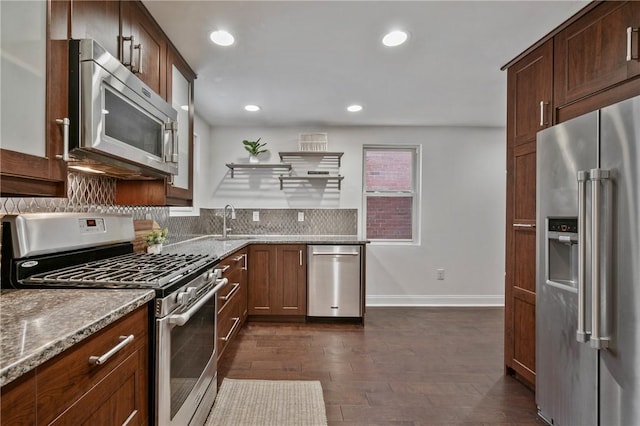 kitchen featuring stone counters, recessed lighting, stainless steel appliances, dark wood-style floors, and tasteful backsplash