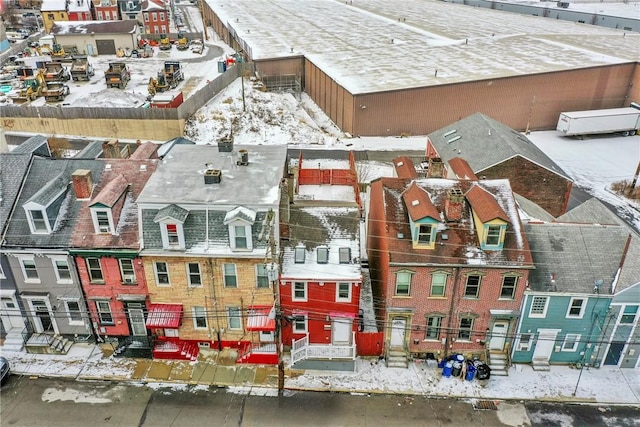 snowy aerial view with a residential view