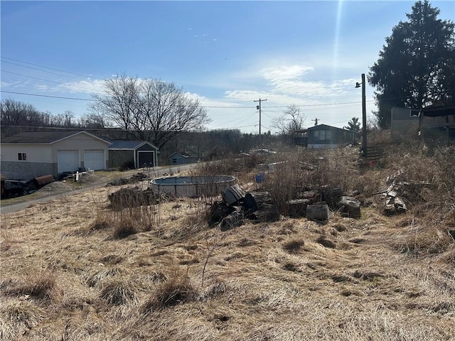 view of yard featuring a garage