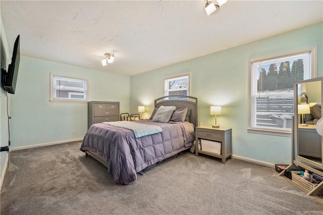 carpeted bedroom with baseboards