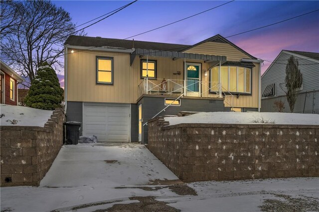 view of front of house featuring a garage and concrete driveway