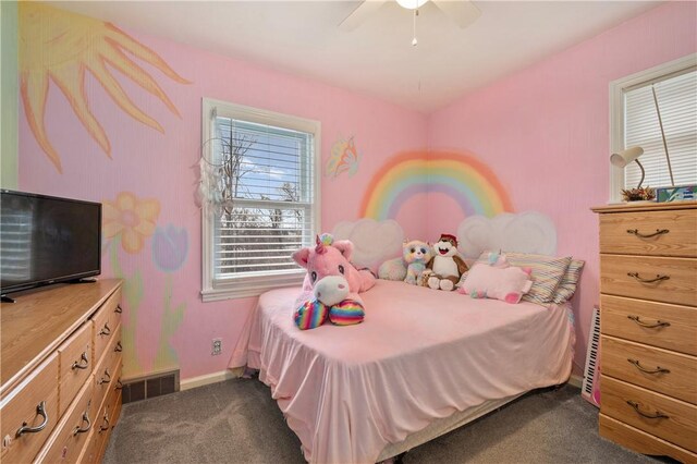 bedroom with dark colored carpet, a ceiling fan, visible vents, and baseboards