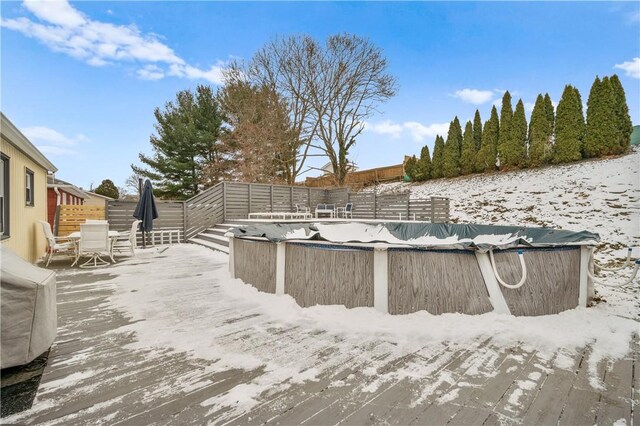 exterior space with outdoor dining area and a deck