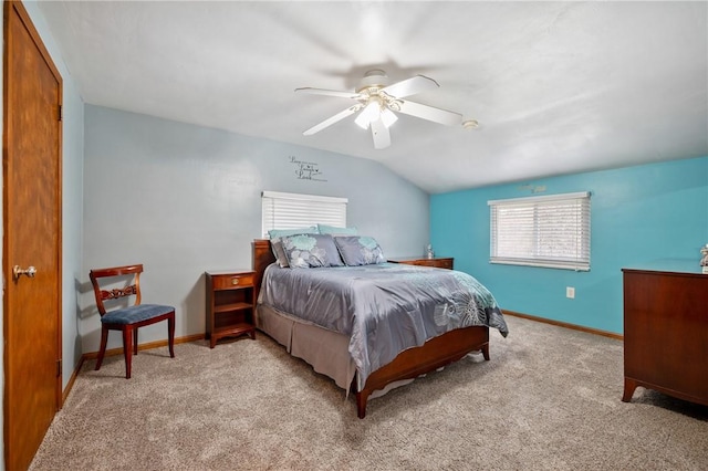 bedroom featuring baseboards, vaulted ceiling, a ceiling fan, and light colored carpet