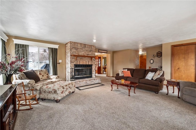 living area with carpet and a fireplace