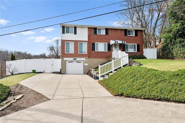 view of front of home with fence, a front lawn, concrete driveway, and brick siding