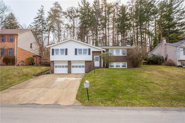 raised ranch with a garage, driveway, brick siding, and a front yard