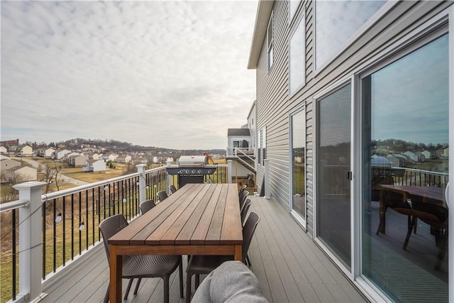 balcony with area for grilling and a residential view