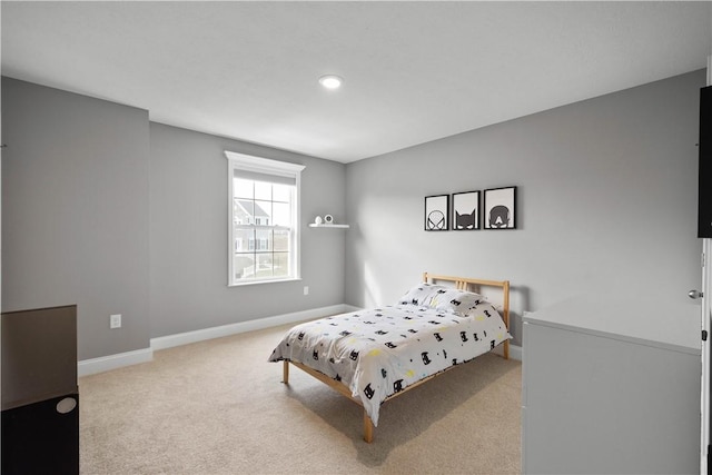 carpeted bedroom with baseboards