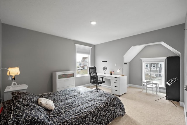 bedroom featuring baseboards and light colored carpet