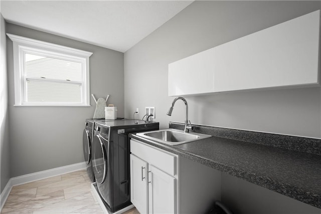 clothes washing area with marble finish floor, cabinet space, a sink, separate washer and dryer, and baseboards