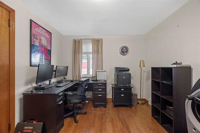 office featuring baseboards and wood finished floors