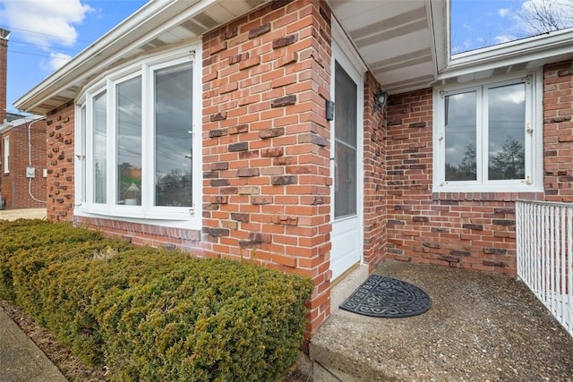 view of property exterior with brick siding