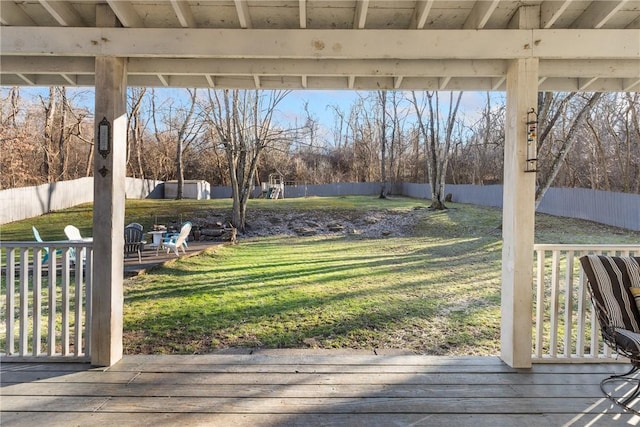 view of yard featuring a deck and a fenced backyard