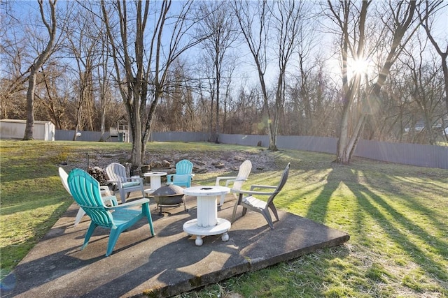 view of yard with a patio area, an outdoor fire pit, and a fenced backyard