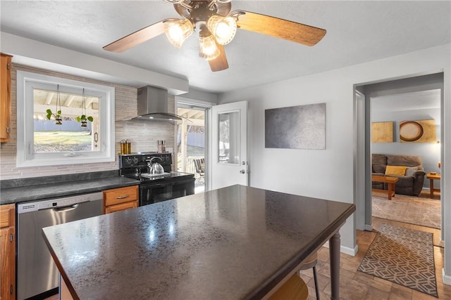 kitchen with dark countertops, stainless steel dishwasher, black electric range, wall chimney range hood, and backsplash