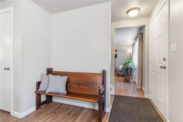 entrance foyer with wood finished floors and baseboards