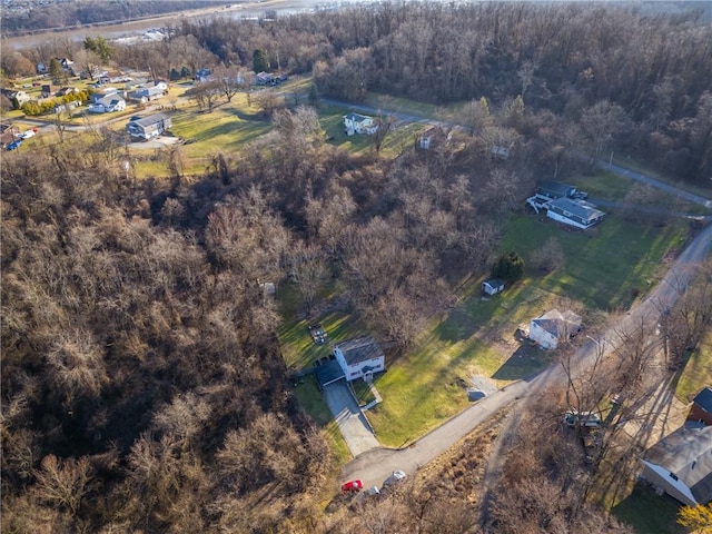 drone / aerial view featuring a view of trees