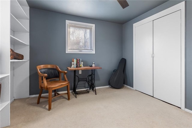 sitting room with carpet floors and baseboards