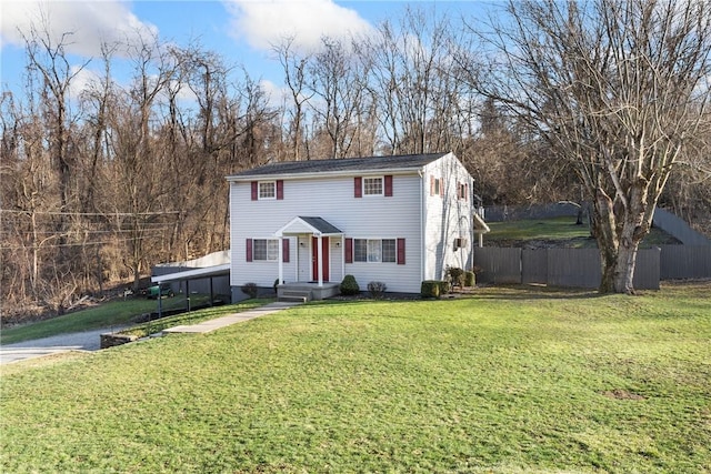 view of front of property with fence and a front lawn