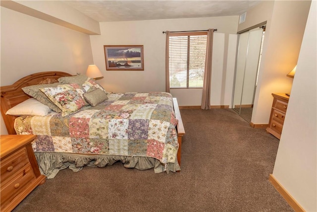 bedroom featuring baseboards and carpet flooring