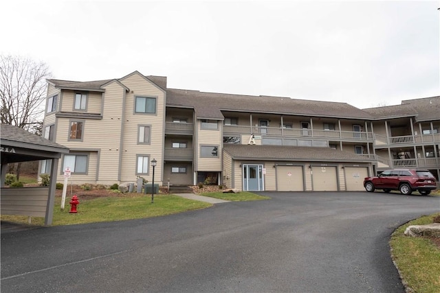 view of property with community garages