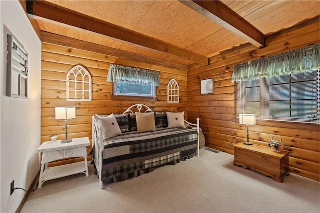 carpeted bedroom with wooden ceiling and beam ceiling