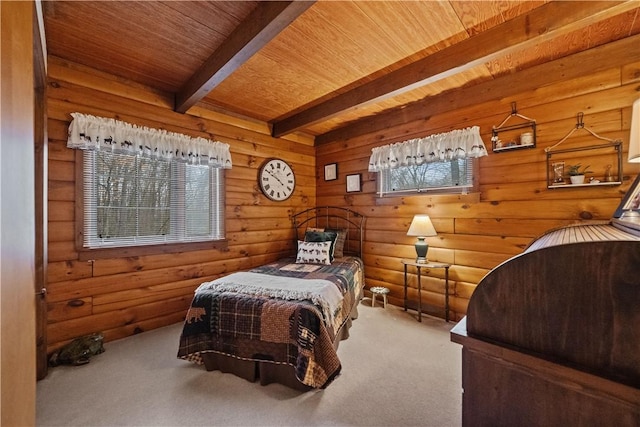 carpeted bedroom featuring wood ceiling and beam ceiling