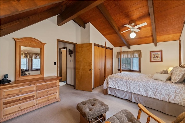 carpeted bedroom with lofted ceiling with beams and wooden ceiling