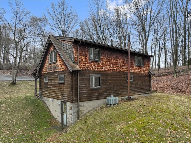 view of home's exterior featuring a yard and cooling unit