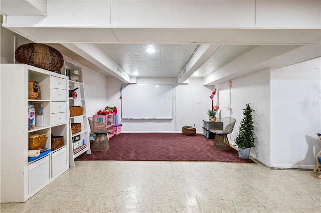 rec room featuring baseboards and tile patterned floors