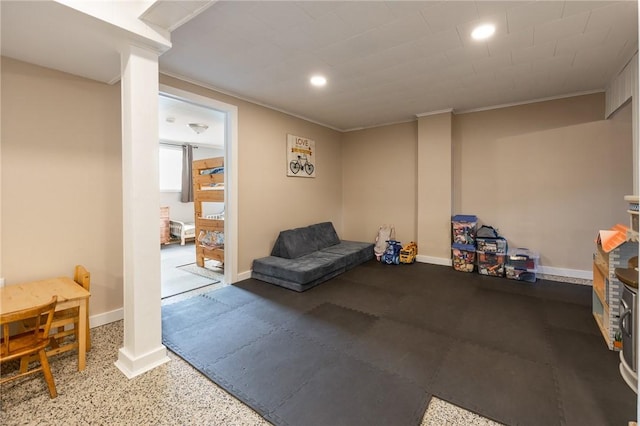 sitting room with ornamental molding, recessed lighting, and baseboards