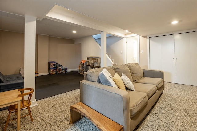 living area with stairs and recessed lighting