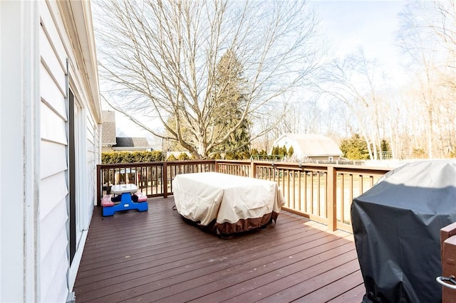 wooden deck featuring grilling area