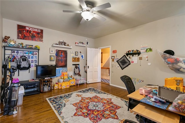 home office with ceiling fan and wood finished floors