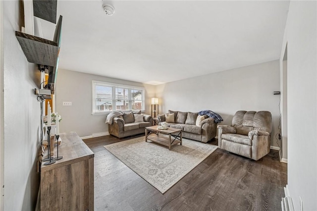 living area featuring dark wood finished floors and baseboards