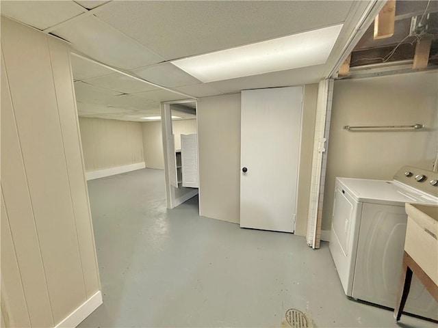 laundry area featuring washer / dryer, baseboards, and laundry area