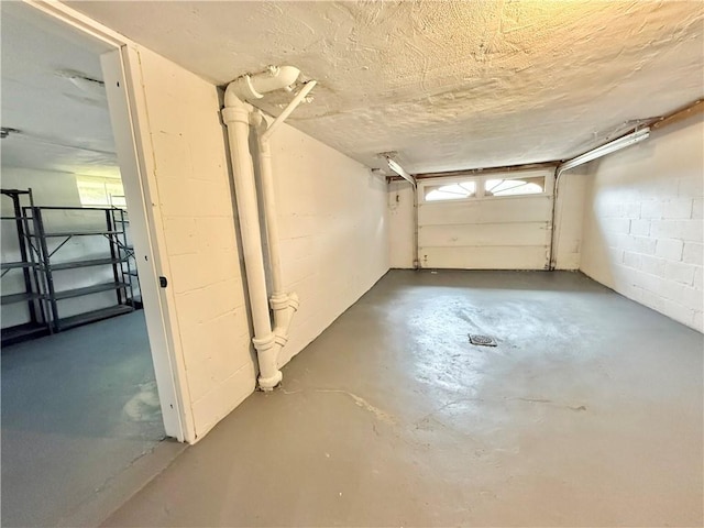 garage featuring concrete block wall