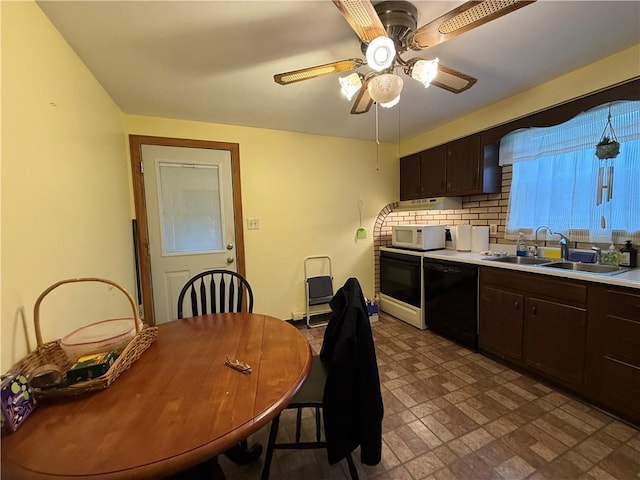 kitchen featuring decorative backsplash, white microwave, a sink, dark brown cabinets, and dishwasher