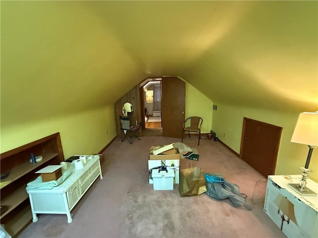 bonus room with vaulted ceiling, carpet floors, visible vents, and baseboards