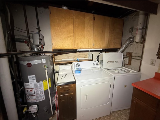 laundry room with separate washer and dryer, gas water heater, and cabinet space