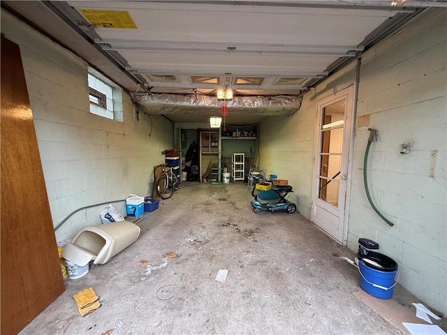 garage featuring concrete block wall