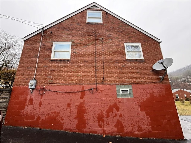 view of home's exterior with brick siding