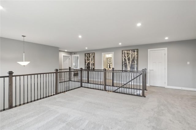 spare room with recessed lighting, carpet flooring, and baseboards