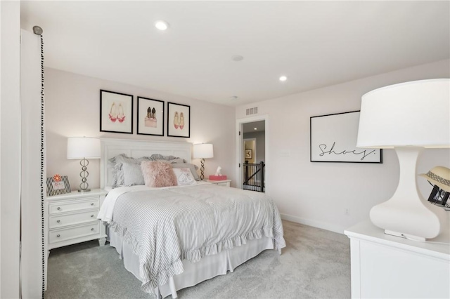 carpeted bedroom with baseboards, visible vents, and recessed lighting