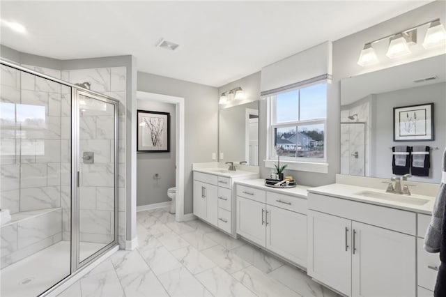 bathroom with marble finish floor, visible vents, toilet, a stall shower, and baseboards