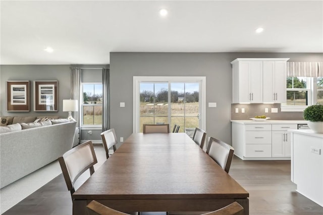 dining space featuring dark wood-style floors, plenty of natural light, and recessed lighting