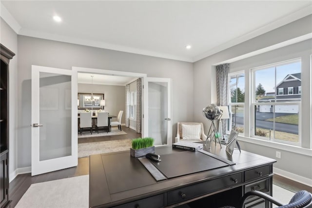 home office featuring dark wood-type flooring, baseboards, french doors, ornamental molding, and an inviting chandelier