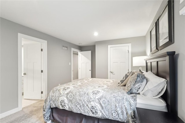 bedroom featuring carpet flooring, visible vents, and baseboards